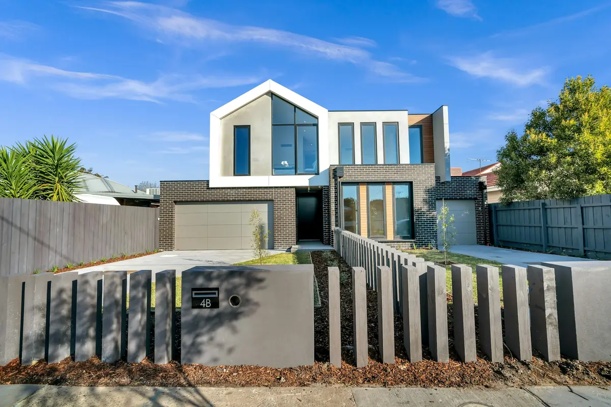 Grey contemporary sectional garage door on a modern home